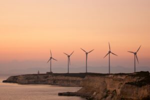 Wind Turbines At sunset, wind turbine renewable. Green energy concept